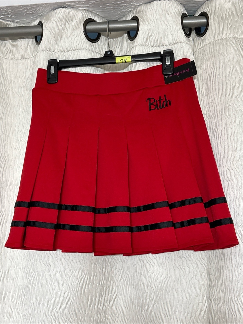 Red Pleated Mini Skirt with Black Trim and Script Detail